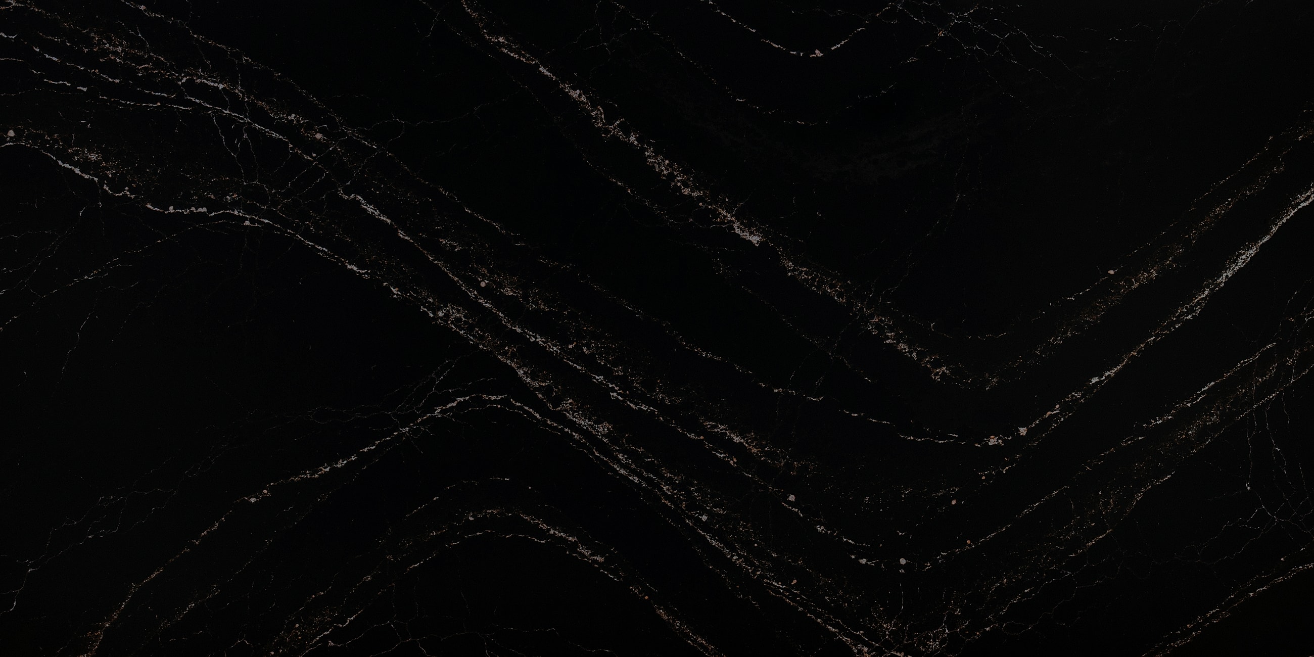 Black marble surface with golden veins.
