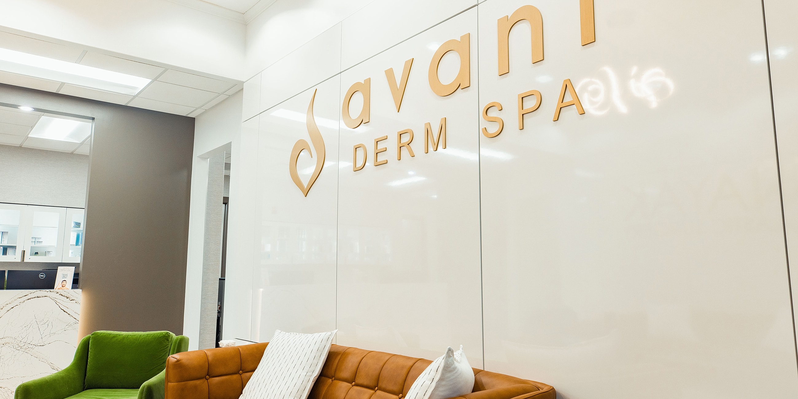 Sleek interior of Avani Derm Spa waiting area.