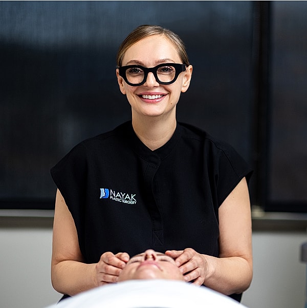 Skilled practitioner offering facial treatment session.