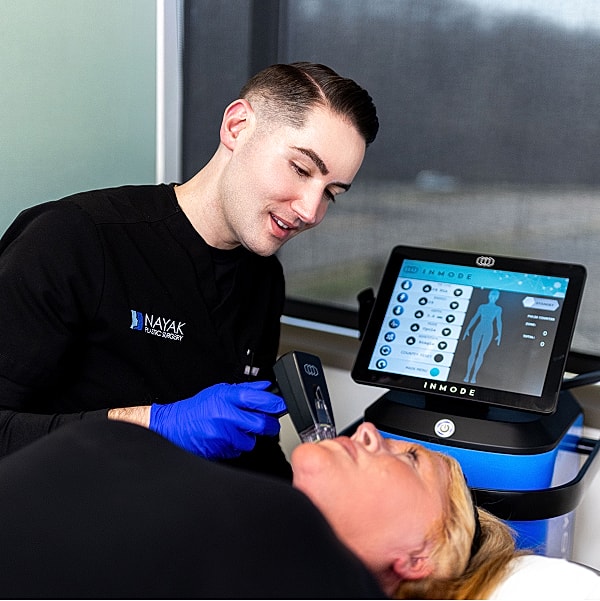 Medical professional performing a treatment on patient.