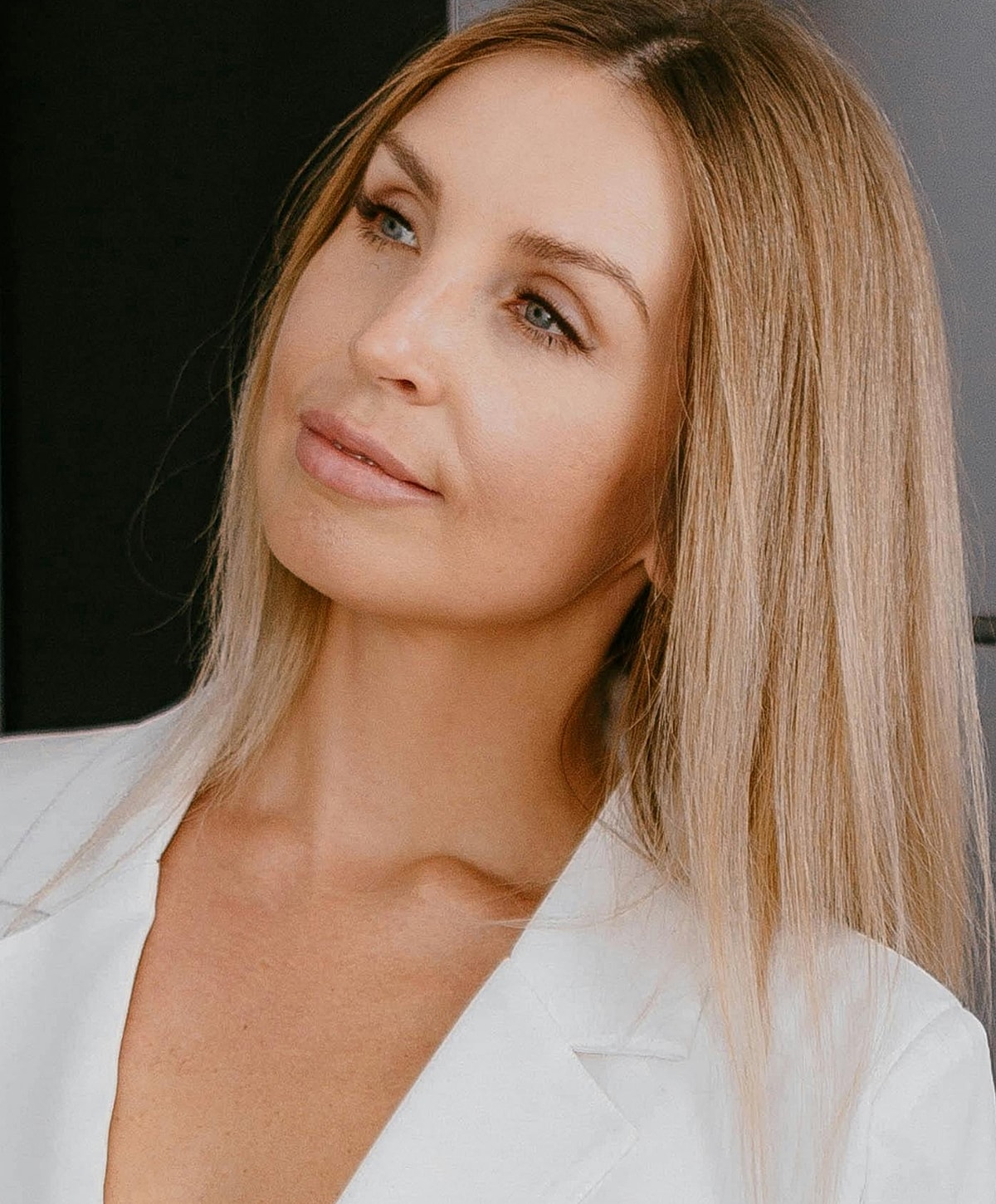 St. Louis AviClear model in stylish attire with long hair.