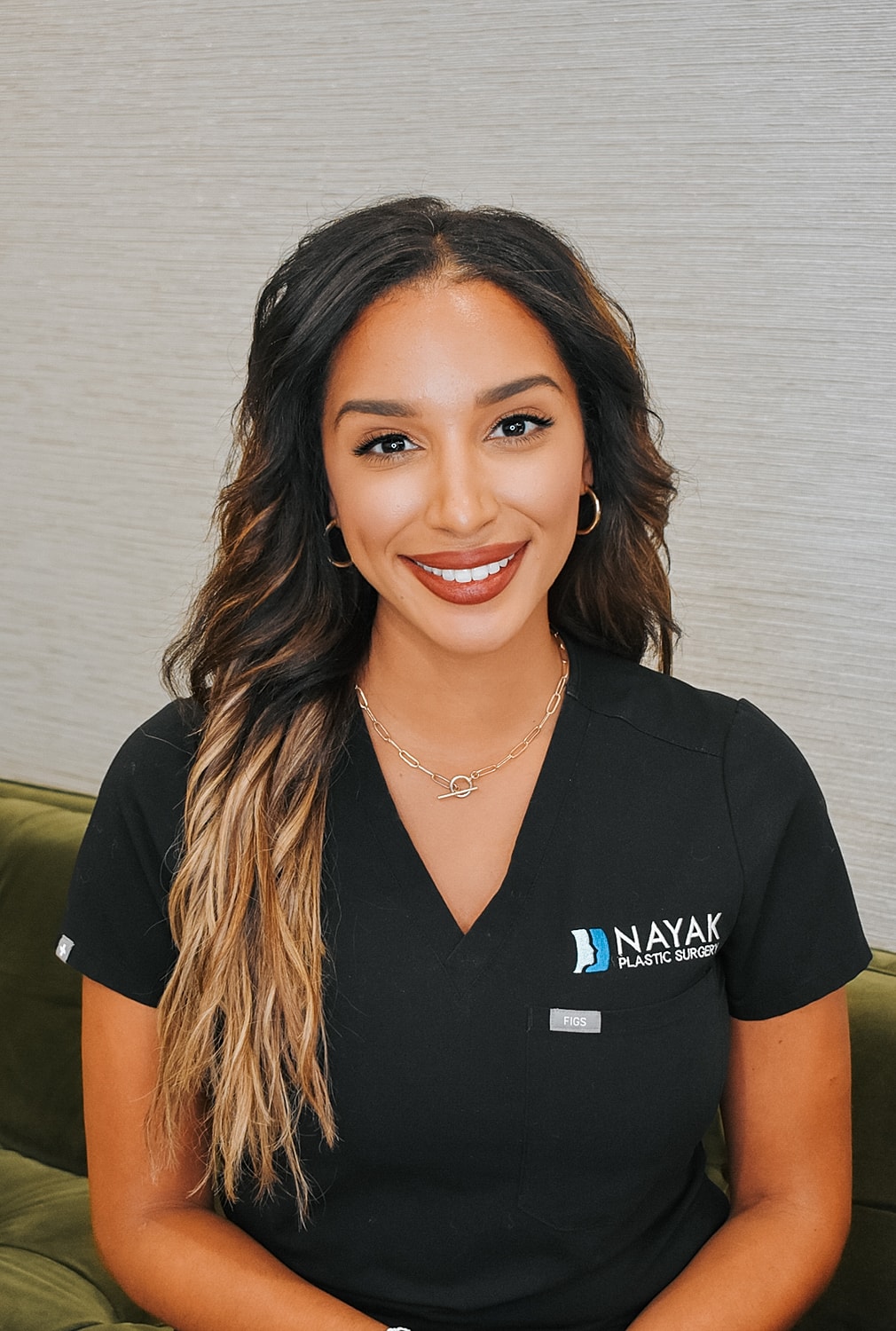 Healthcare professional in a plastic surgery setting.