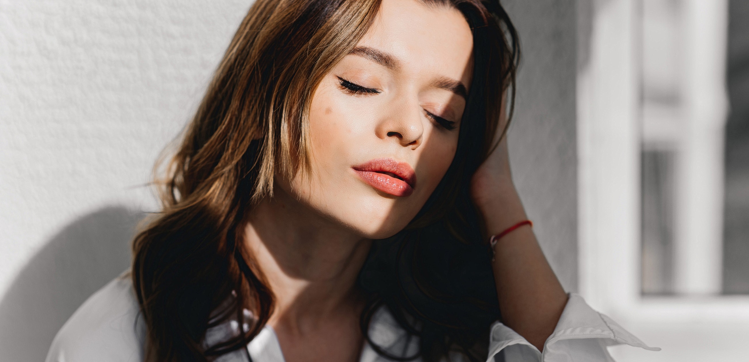 Patient receiving cosmetic injectable treatment in clinic.